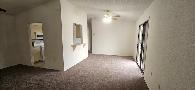 carpeted empty room featuring lofted ceiling and ceiling fan