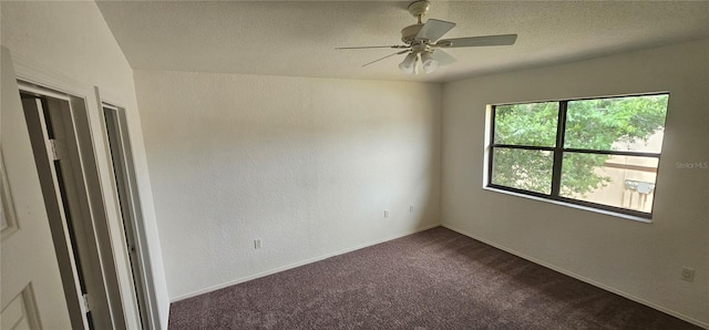 spare room with carpet floors and ceiling fan