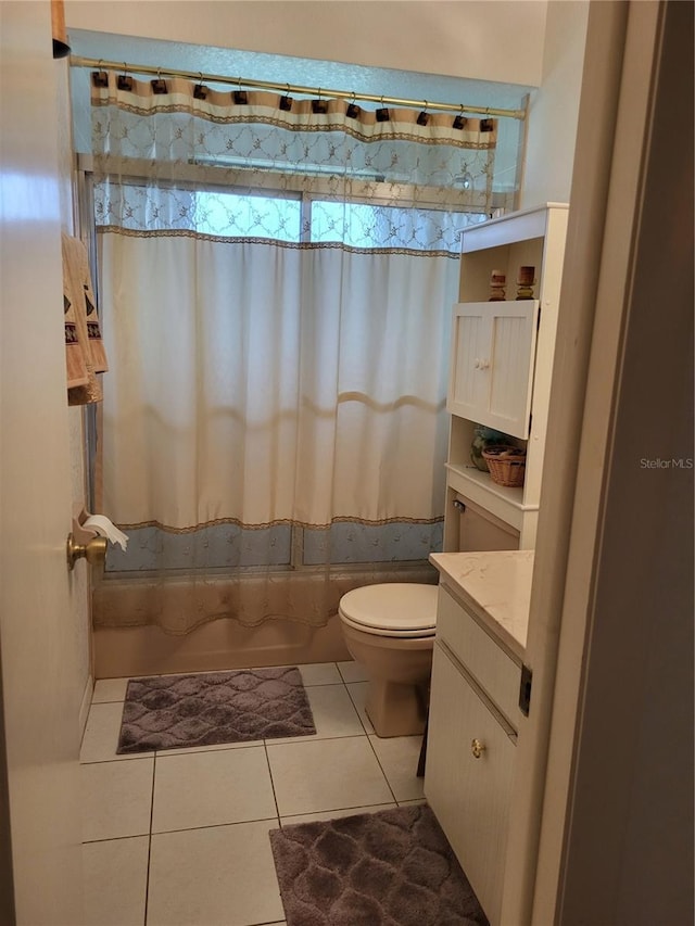 full bathroom featuring toilet, vanity, shower / tub combo, and tile patterned floors