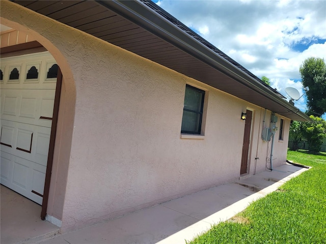 view of side of property with a garage