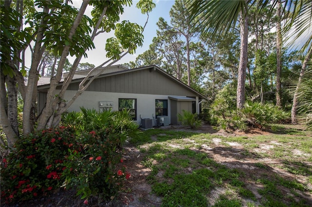 rear view of property with central air condition unit