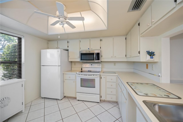 kitchen featuring ceiling fan, white cabinetry, white appliances, and light tile patterned floors