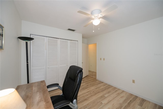 office space with light hardwood / wood-style flooring and ceiling fan