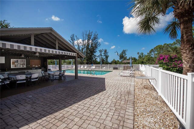 view of swimming pool featuring a patio area