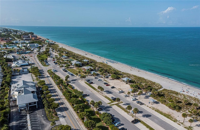 bird's eye view featuring a view of the beach and a water view