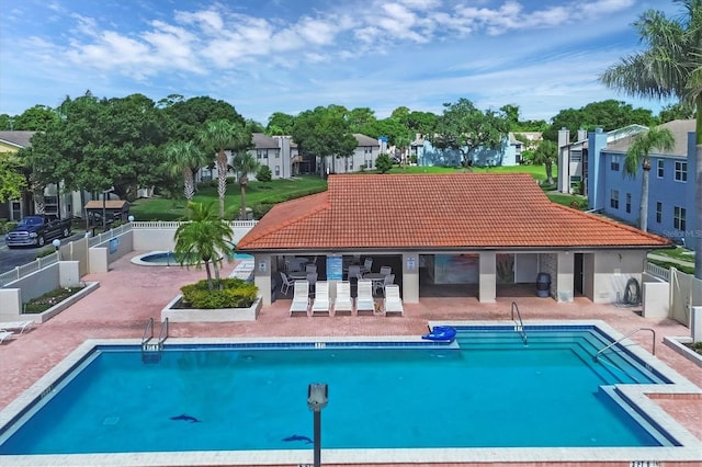 view of swimming pool with a patio area