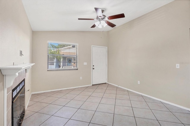 unfurnished living room featuring ceiling fan, light tile patterned flooring, and lofted ceiling