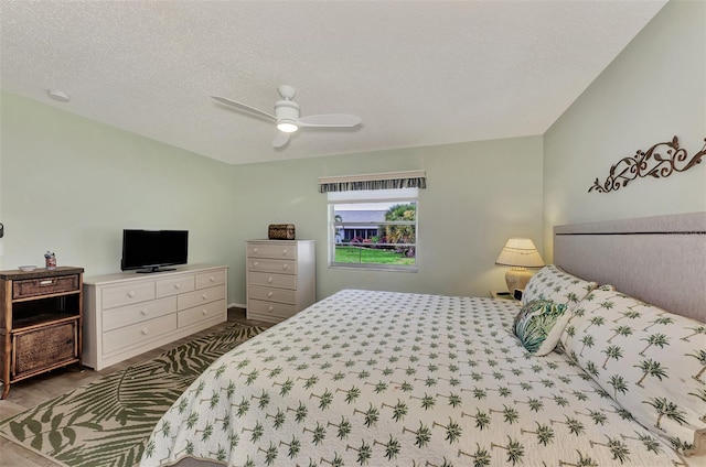 bedroom featuring a textured ceiling and ceiling fan