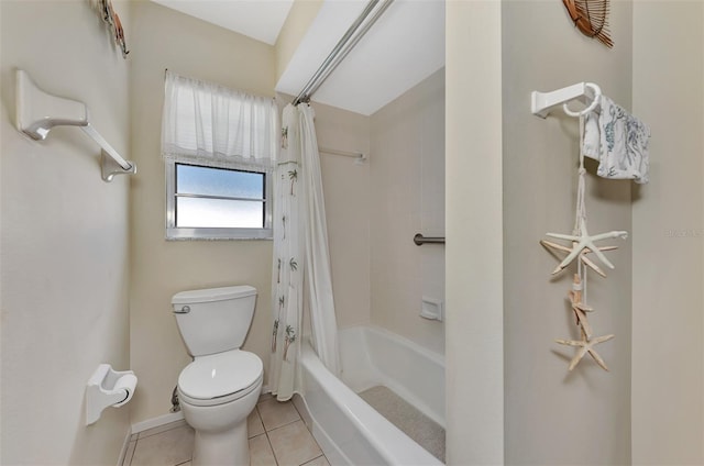 bathroom featuring tile patterned flooring, toilet, and shower / bath combination with curtain