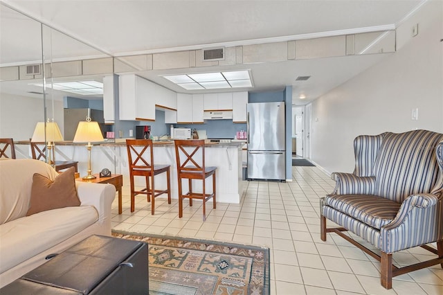 tiled living room with ornamental molding