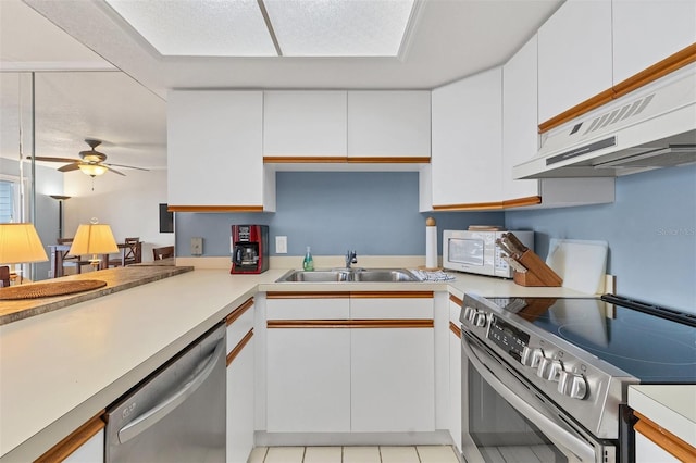 kitchen with white cabinetry, sink, ceiling fan, stainless steel appliances, and ventilation hood