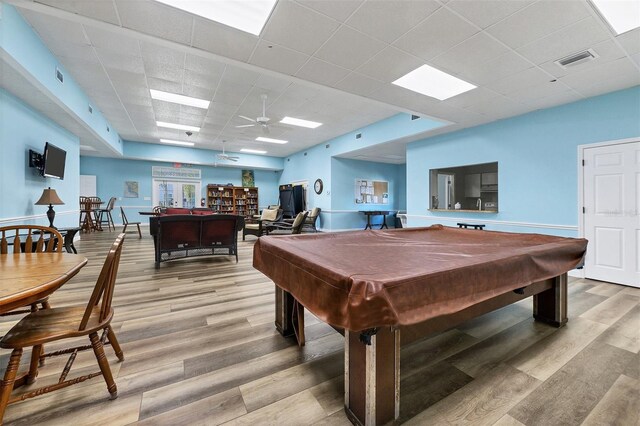 rec room featuring a paneled ceiling, ceiling fan, light hardwood / wood-style floors, and billiards