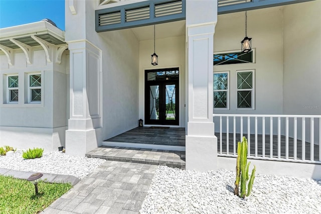 doorway to property featuring french doors and a porch