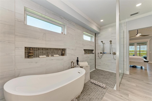 bathroom featuring wood-type flooring, independent shower and bath, tile walls, and ornamental molding