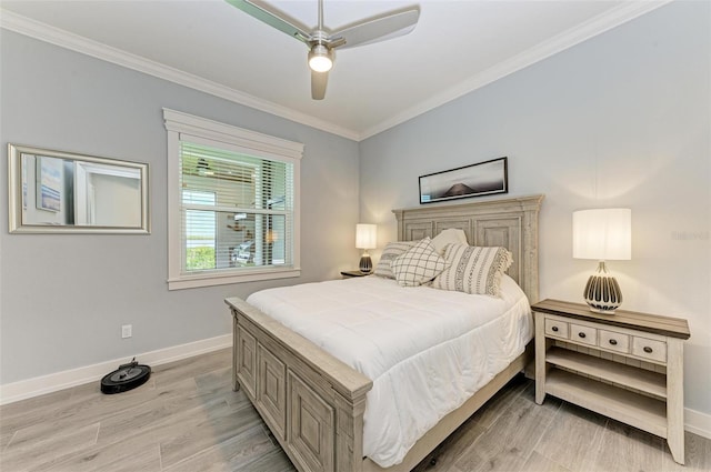 bedroom featuring ceiling fan, light hardwood / wood-style floors, and ornamental molding