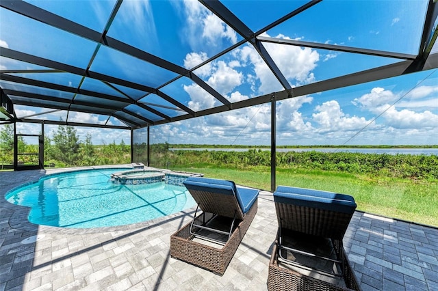 view of swimming pool with a lanai, an in ground hot tub, and a patio