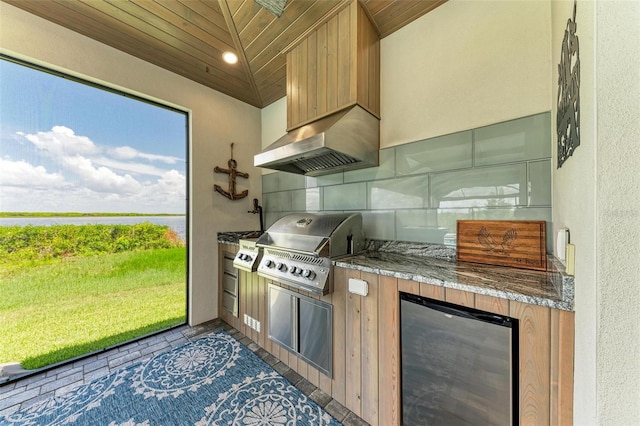 kitchen with lofted ceiling, refrigerator, tasteful backsplash, wood ceiling, and extractor fan