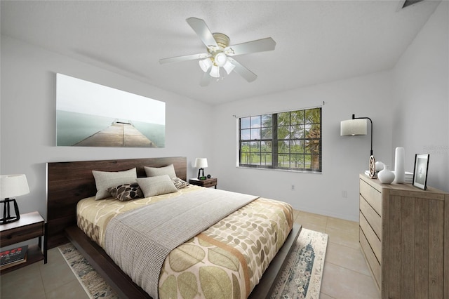 bedroom featuring ceiling fan and light tile patterned flooring