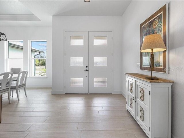 entryway featuring french doors and baseboards