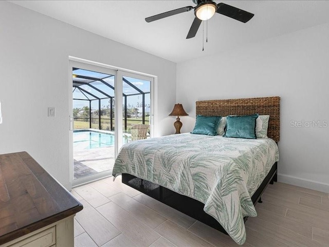 bedroom with ceiling fan, wood finished floors, a sunroom, baseboards, and access to exterior