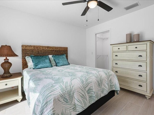 bedroom with ceiling fan and visible vents