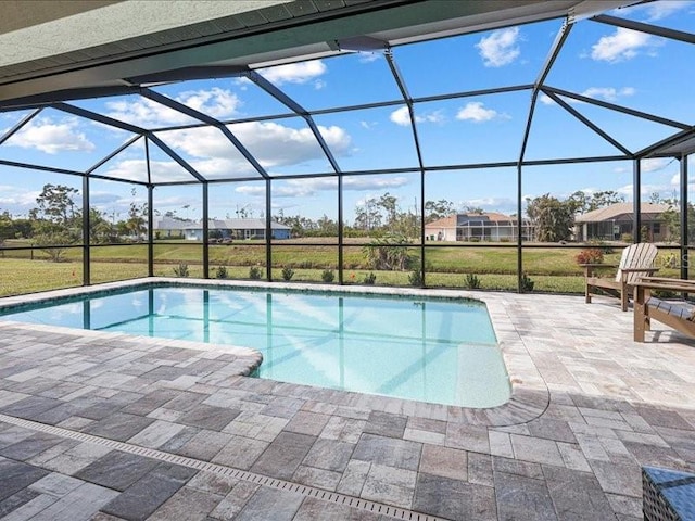 pool with a lanai and a patio area