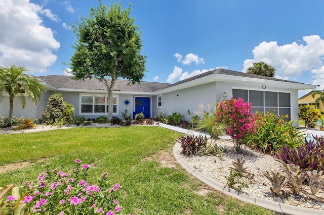 single story home featuring a front yard