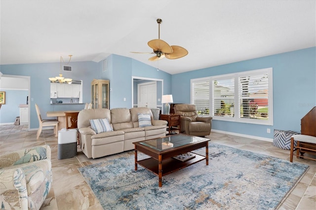 living room with lofted ceiling and ceiling fan with notable chandelier