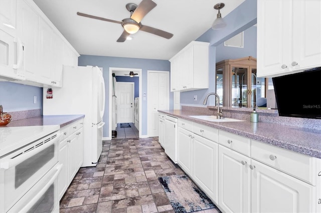 kitchen featuring sink, white appliances, ceiling fan, white cabinetry, and decorative light fixtures