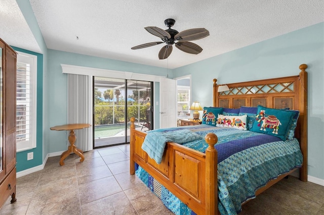 bedroom featuring ceiling fan, access to exterior, and a textured ceiling