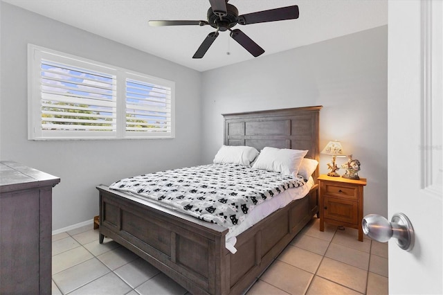 bedroom featuring ceiling fan and light tile patterned flooring