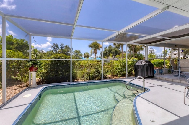 view of swimming pool featuring grilling area, a patio, and glass enclosure