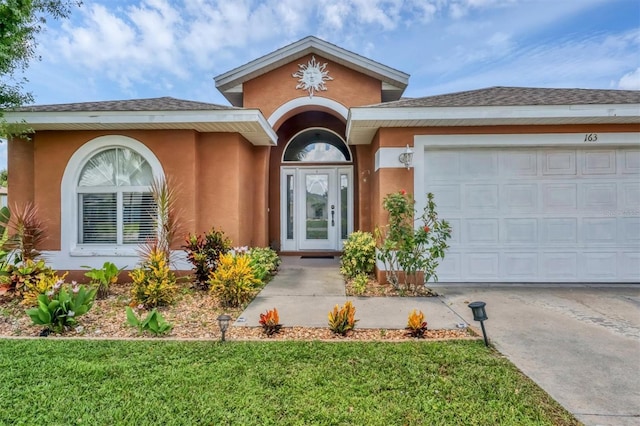 view of front of property with a garage