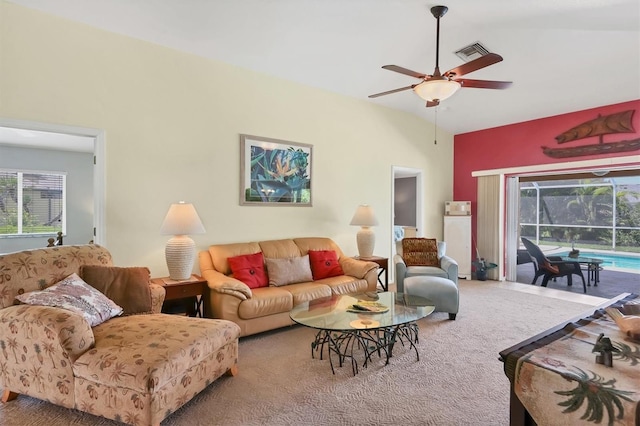 carpeted living room with lofted ceiling and ceiling fan