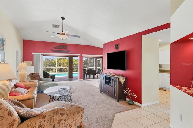 tiled living room featuring lofted ceiling and ceiling fan