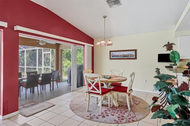 tiled dining space with lofted ceiling and ceiling fan with notable chandelier