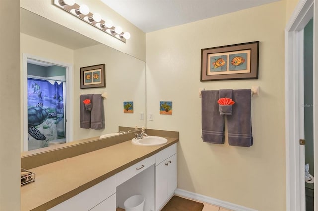 bathroom with vanity, toilet, and tile patterned flooring