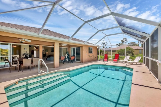 view of pool featuring a patio, a lanai, and ceiling fan