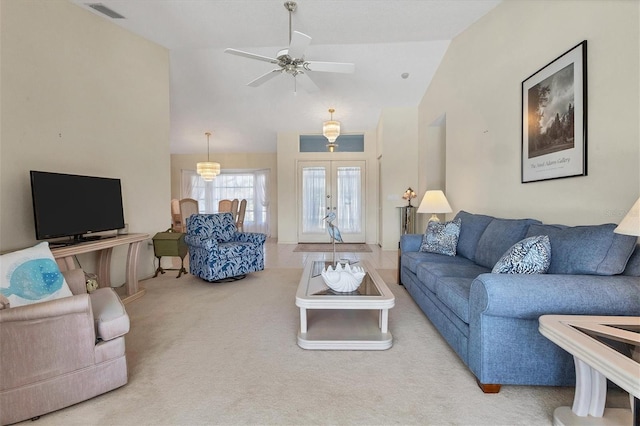 living room with vaulted ceiling, french doors, ceiling fan, and carpet