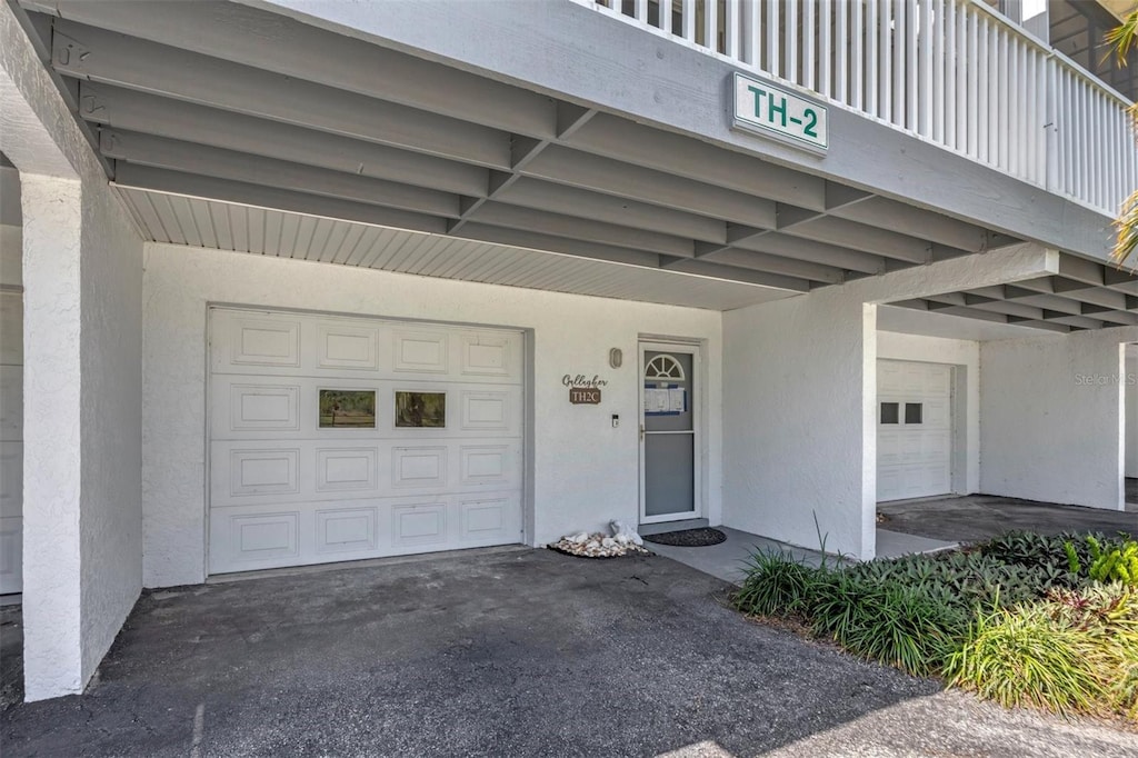 property entrance with a garage