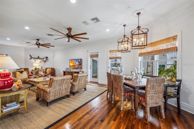 dining room with hardwood / wood-style flooring and ornamental molding