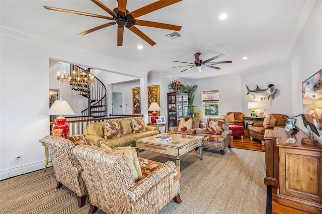 living room with ornamental molding and ceiling fan with notable chandelier