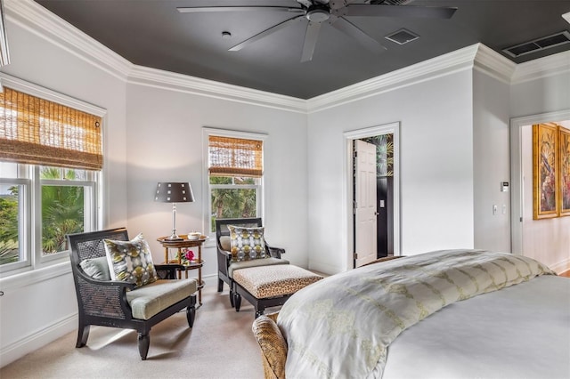 carpeted bedroom with ornamental molding and ceiling fan