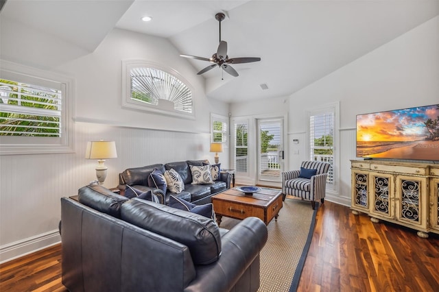 living room with ceiling fan, lofted ceiling, and dark hardwood / wood-style floors