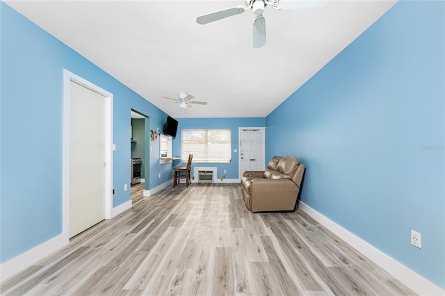 unfurnished room featuring ceiling fan and light hardwood / wood-style floors