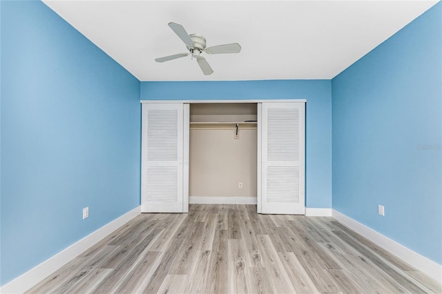 unfurnished bedroom featuring ceiling fan, light hardwood / wood-style flooring, and a closet