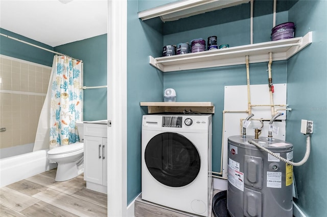 washroom featuring light wood-type flooring, washer / clothes dryer, and water heater