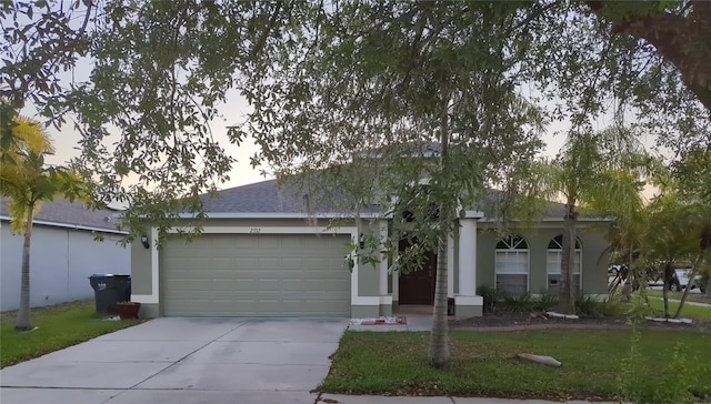 single story home featuring a garage