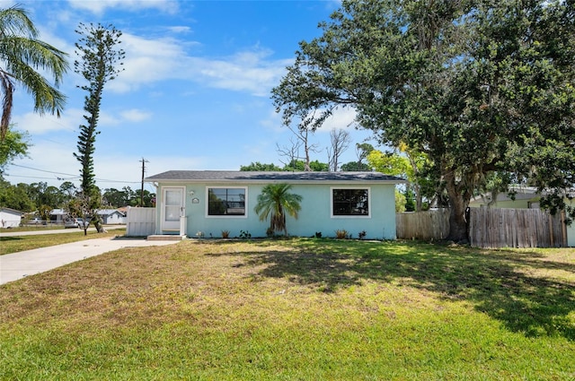 ranch-style house with a front yard