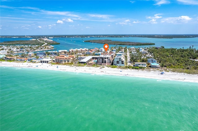 drone / aerial view with a water view and a view of the beach